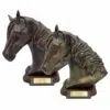 Resin horse keepsake urn with wood base, gold and copper