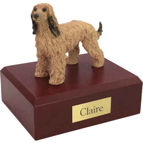 Memorial cremation urn with standing afghan hound dog figurine on walnut box