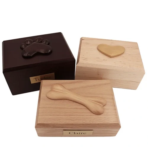 Traditional wood pet cremation urns with paw heart and bone adornments