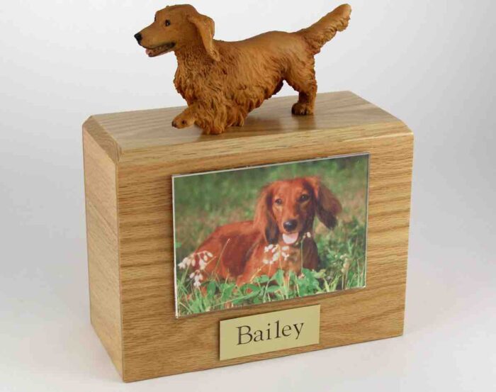 Wood cremation urn with figurine and 3.5 x 5" photo holder.