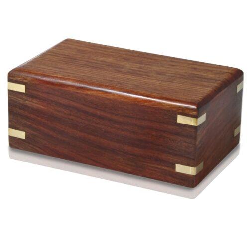 Traditional rosewood cremation urn with brass corner inlays