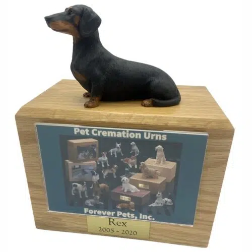 Black Dachshund dog figurine atop wood memorial photo holder cremation urn