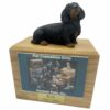 Black Dachshund dog figurine atop wood memorial photo holder cremation urn