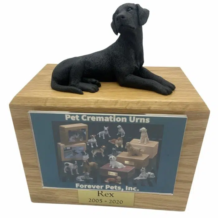 Black Labrador dog figurine atop wood memorial photo holder cremation urn