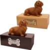 Budget dog figurine cremation urn, oak or walnut, with red long-haired dachshund figurine, engraved acrylic plaque