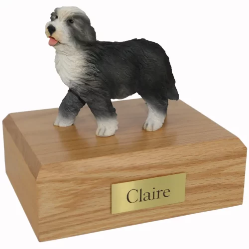 Memorial cremation urn with standing bearded collie dog figurine