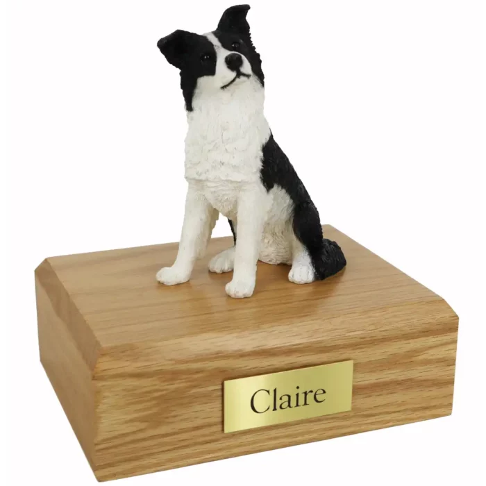 Memorial cremation urn with sitting border collie dog figurine