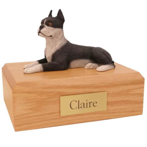 Memorial cremation urn with laying black and white boston terrier dog figurine