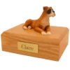 Memorial pet cremation urn with laying ears down boxer dog figurine