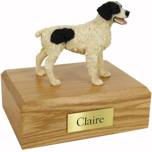 Memorial pet cremation urn with standing black & white Brittany dog figurine