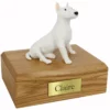 Memorial pet cremation urn with sitting white bull terrier dog figurine