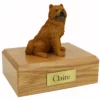 Memorial pet cremation urn with sitting Chow Chow dog figurine