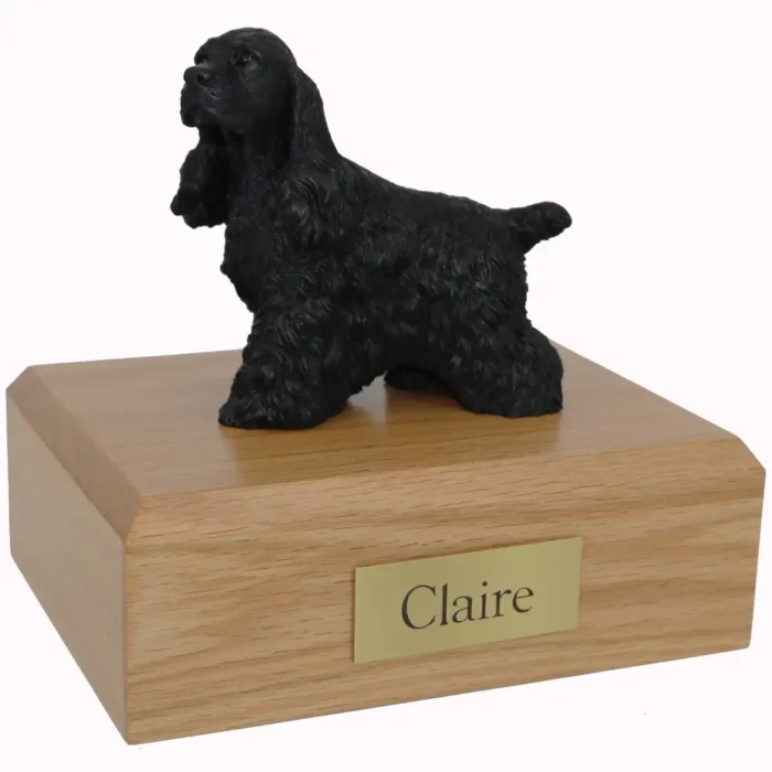 Memorial pet cremation urn with standing black cocker spaniel dog figurine