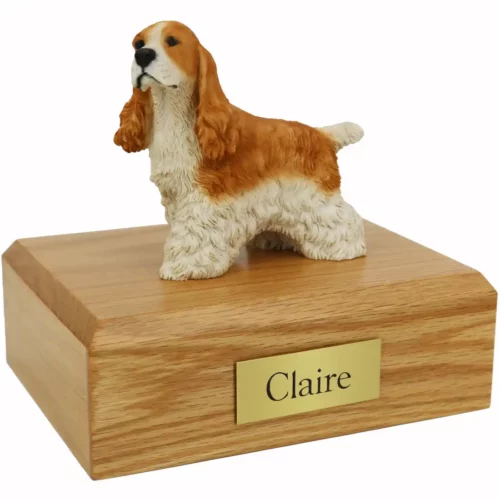 Memorial pet cremation urn with standing tan & white cocker spaniel dog figurine