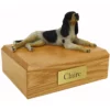 Memorial pet cremation urn with laying coonhound dog figurine