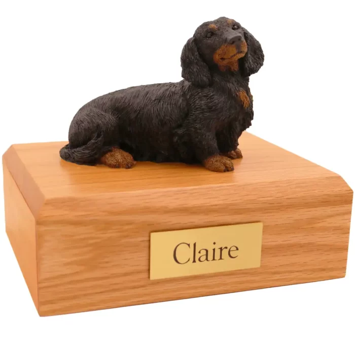 Memorial pet cremation urn with long haired dachshund dog figurine