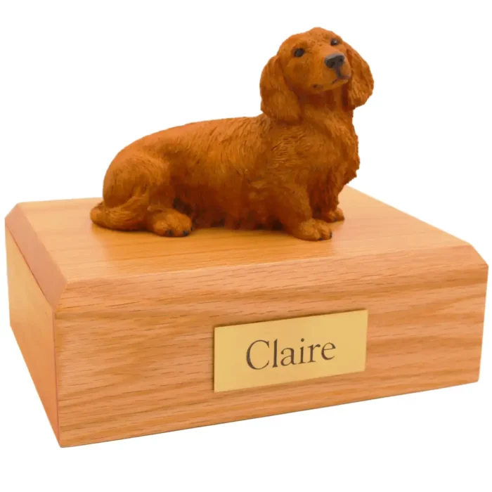 Memorial pet cremation urn with brown long haired dachshund dog figurine