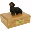 Memorial pet cremation urn with wired haired dachshund dog figurine