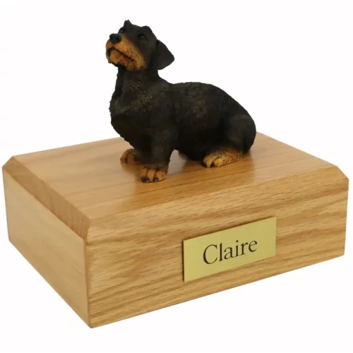 Memorial pet cremation urn with wired haired dachshund dog figurine