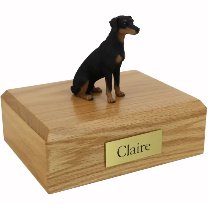 Memorial pet cremation urn with sitting ears down black doberman dog figurine