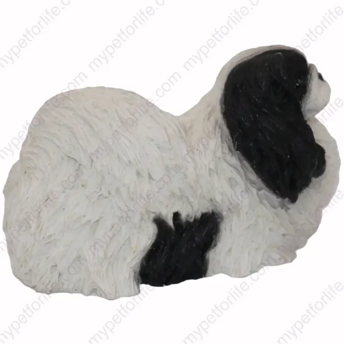 Black and white Pekingese dog figurine for memorial urn, side