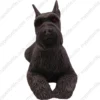 Laying ears up Black Schnauzer dog figurine for memorial urn, front