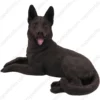 Laying black German Shepherd dog figurine for memorial urn, front