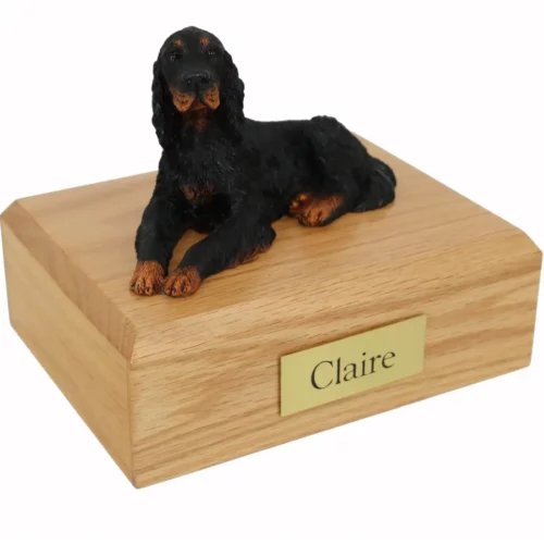 Laying gordon setter dog figurine on wood memorial cremation urn