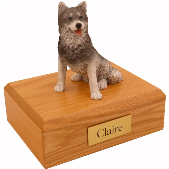 Sitting husky dog figurine on wood memorial cremation urn