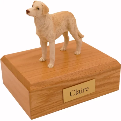 Standing yellow labrador retriever dog figurine on wood memorial cremation urn