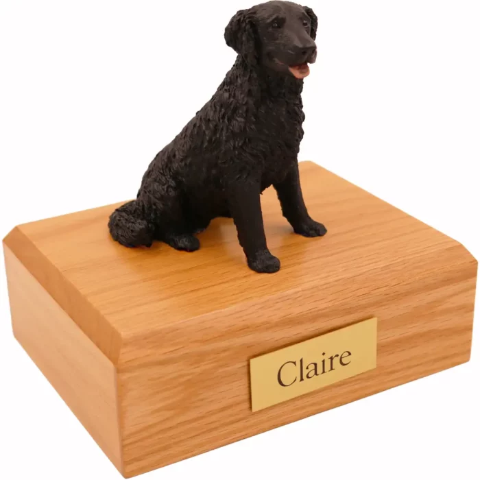 Sitting black labrador retriever dog figurine on wood memorial cremation urn