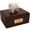 Standing samoyed dog figurine on wood memorial cremation urn