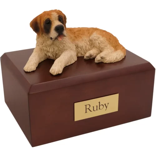 Laying Saint Bernard dog figurine on wood memorial cremation urn