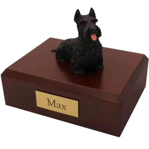 Sitting black scottish terrier dog figurine on wood memorial cremation urn