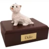 Sitting westie west highland terrier dog figurine on wood memorial cremation urn