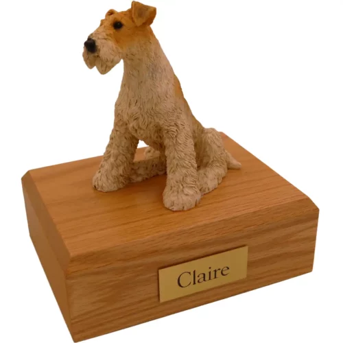 Sitting Fox Terrier dog figurine on wood memorial pet cremation urn