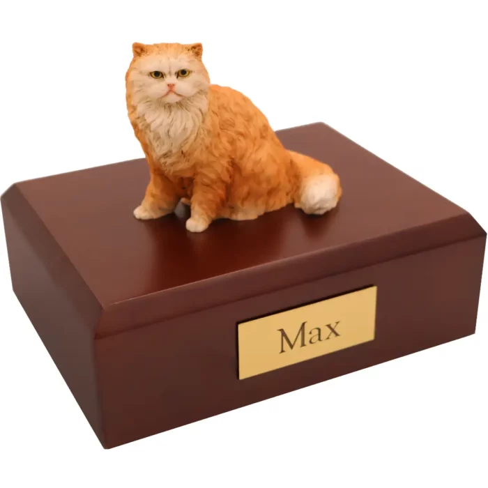 Orange Persian cat figurine on wood memorial cremation urn