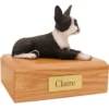 Laying black/white boston terrier dog figurine on wood memorial pet cremation urn