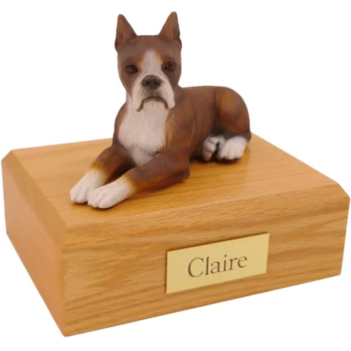 Laying ears up brindle boxer dog figurine on wood memorial pet cremation urn