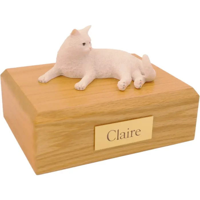 Laying white british shorthair cat figurine on wood memorial pet cremation urn