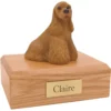 Sitting bluff cocker spaniel dog figurine on wood memorial pet cremation urn
