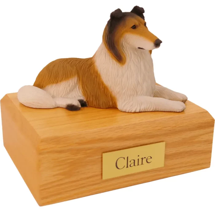 Laying sable collie dog figurine on wood memorial pet cremation urn