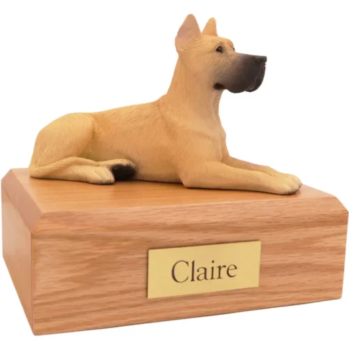 Laying ears up fawn great dane dog figurine on wood memorial pet cremation urn