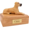 Laying ears down fawn great dane dog figurine on wood memorial pet cremation urn