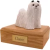 Standing white Maltese dog figurine on wood memorial pet cremation urn