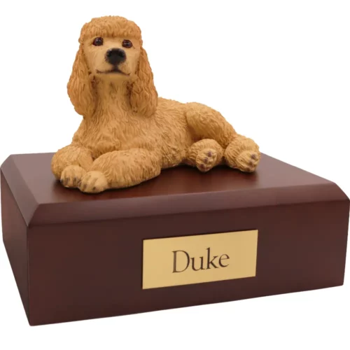 Laying apricot poodle dog figurine on wood memorial pet cremation urn