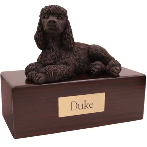 Laying bronze look poodle dog figurine on wood memorial pet cremation urn