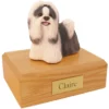 Standing black and white shih tzu dog figurine on wood memorial pet cremation urn