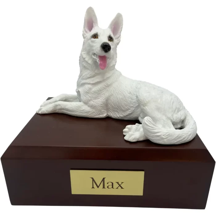 Laying white German Shepherd dog figurine on wood memorial pet cremation urn