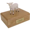White goat figurine on wood memorial pet cremation urn